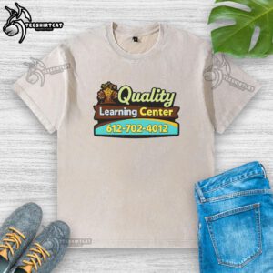 Premium quality Learning Center washed t-shirt displayed on a wooden table, showcasing its soft fabric and stylish design.