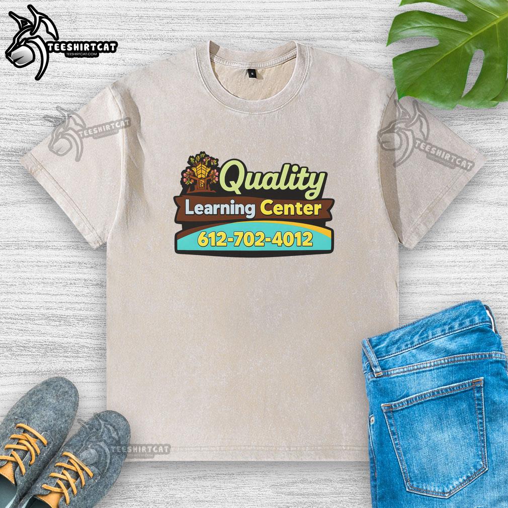 Premium quality Learning Center washed t-shirt displayed on a wooden table, showcasing its soft fabric and stylish design.