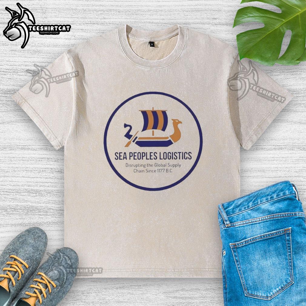 Alt Text: Premium Sea Peoples Logistics logo on a washed t-shirt, symbolizing disruption in global supply chains since 1177 BC.
