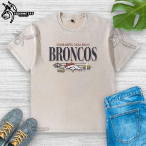 Alt Text: Vintage washed t-shirt featuring Denver Broncos Super Bowl Champions XXII and XXIII graphics in vibrant colors.