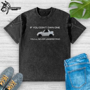 Alt Text: Stylish Pretty-X90 washed t-shirt displayed on a hanger, showcasing its unique design and comfortable fit.