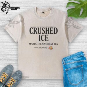 Refreshing iced tea with top-crushed ice served in a glass beside a washed T-shirt for a perfect summer sip.