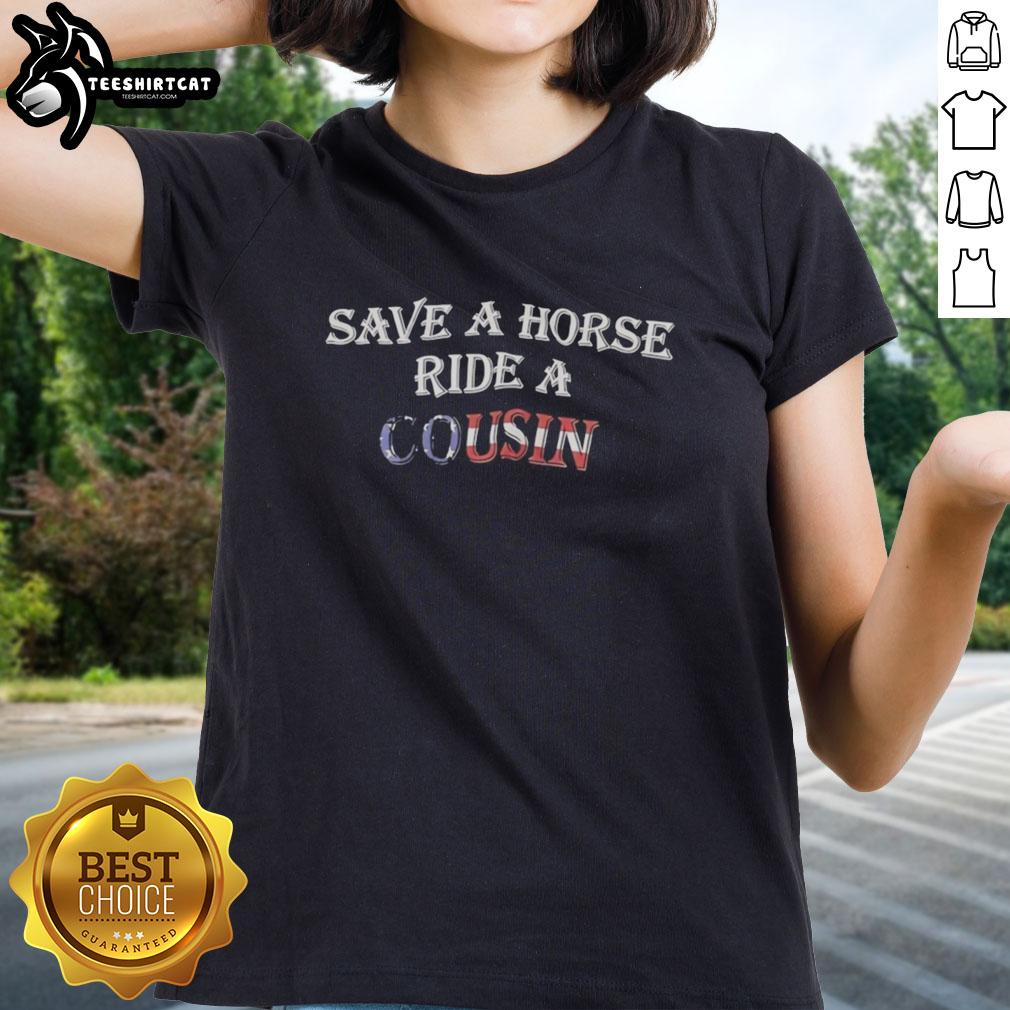 Alt Text: Women wearing a 'Hot Save A Horse Ride A Cousin' tee, enjoying a fun outdoor event with horses in the background.