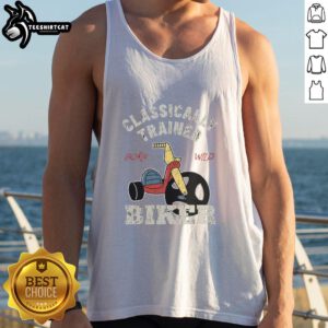 Classically trained biker wearing a 'Born Wild' tank top, showcasing a stylish blend of fashion and freedom on the road.