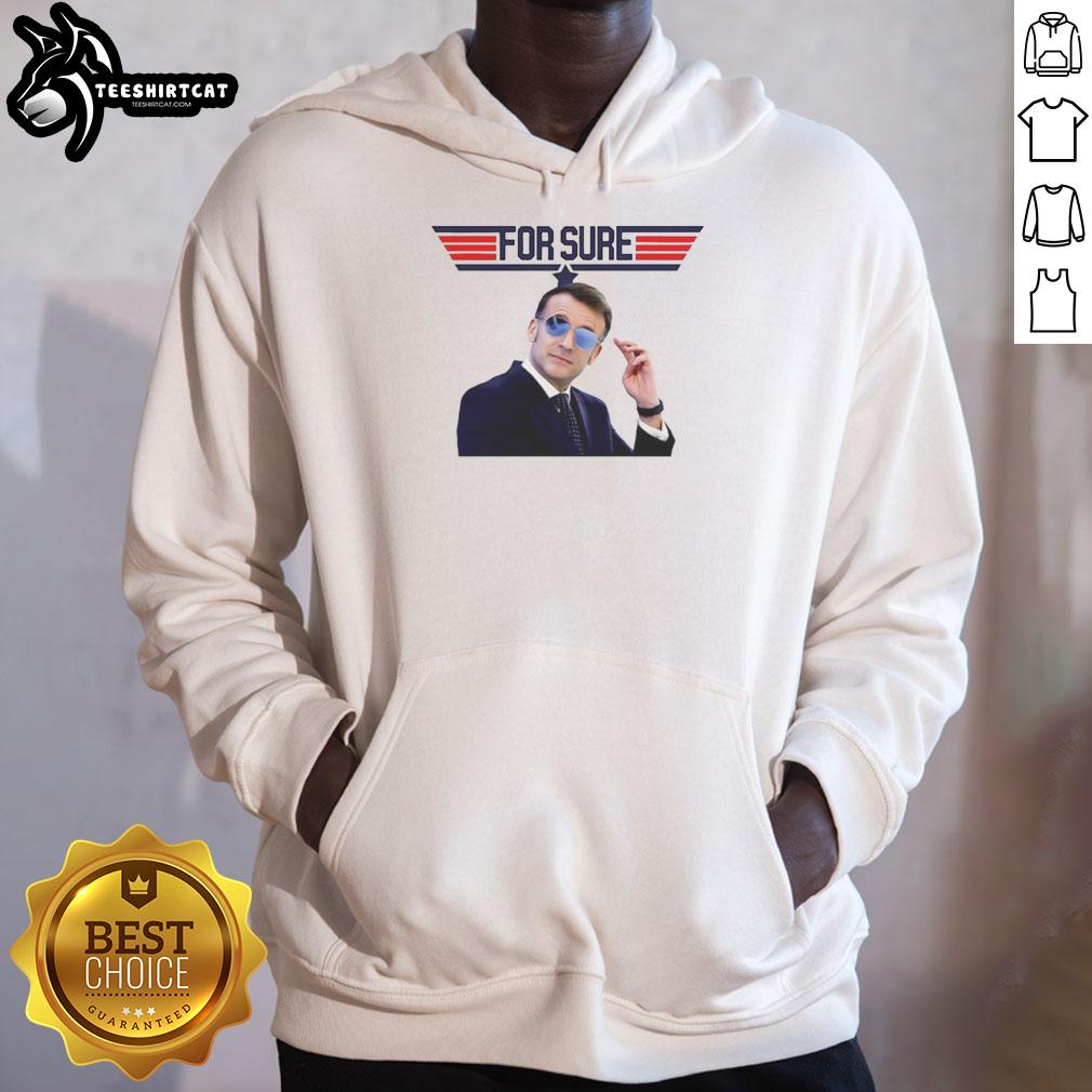 Emmanuel Macron wearing a Nice hoodie featuring the Top Gun logo, showcasing a stylish and trendy look.