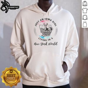 Official Just An Iowa Girl Living In A New York World Hoodie displayed on a mannequin against a city backdrop.