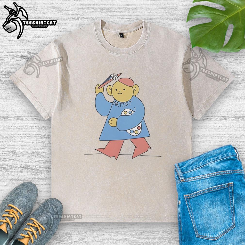 Alt Text: Original I Am Artist cartoon design on a washed t-shirt, featuring vibrant colors and a creative artistic theme.
