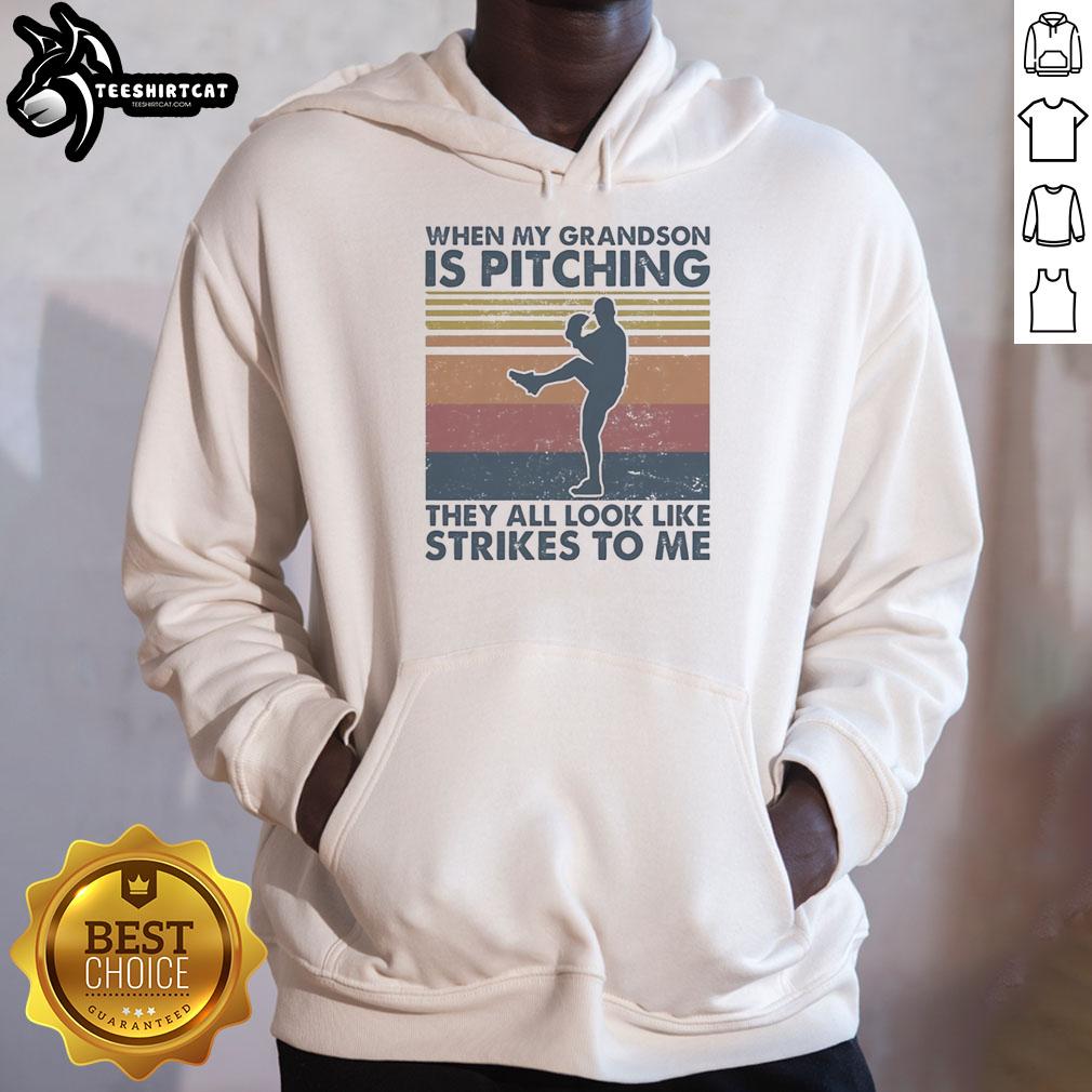 Vintage hoodie featuring 'When My Grandson Is Pitching, They All Look Like Strikes To Me' design for baseball fans.