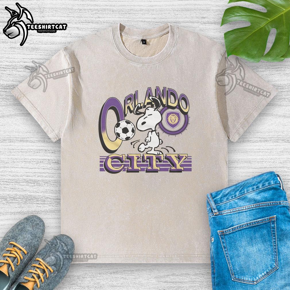Alt Text: Premium Peanuts Snoopy x Orlando City washed t-shirt featuring vibrant graphics and a comfortable fit for fans.