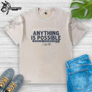 Alt Text: Premium Sam Darnold Anything Is Possible washed t-shirt displayed on a hanger, perfect for fans and casual wear.