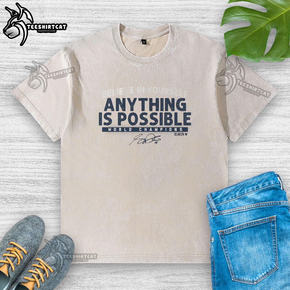 Alt Text: Premium Sam Darnold Anything Is Possible washed t-shirt displayed on a hanger, perfect for fans and casual wear.