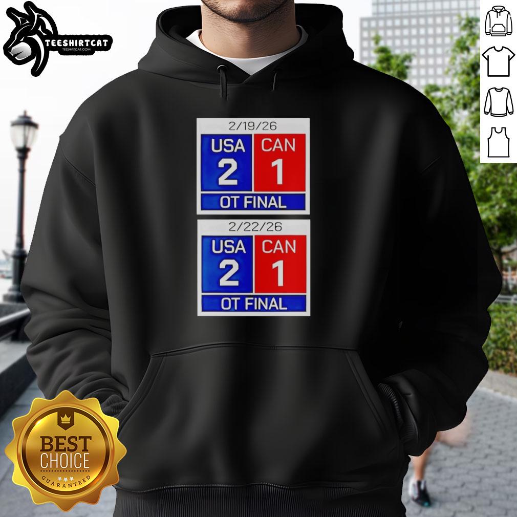 Alt Text: Premium hoodie featuring the scoreboard for USA 2, Canada 1 in OT, celebrating American hockey victory 2026.