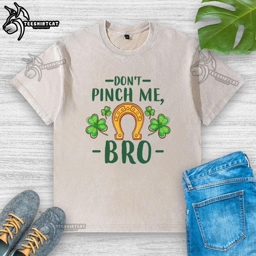 Alt Text: Pretty Don't Pinch Me Bro St. Patrick's Day washed t-shirt featuring horseshoe and shamrock design for festive wear.