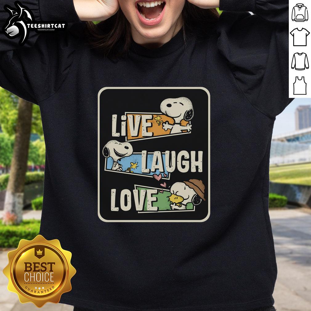 Cozy sweatshirt featuring Snoopy with 'Loves to Live and Laugh' text, perfect for casual and playful outfits.