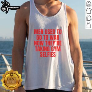 Man in tank top flexing in gym, embodying the phrase 'Good Men Used To Go To War, Now Theyre Taking Gym Selfies.'