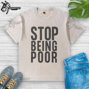 Official Stop Being Poor washed t-shirt featuring bold text design, perfect for casual wear and statement fashion.