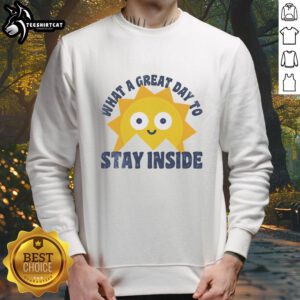 Cozy Official What A Great Day To Stay Inside Sweatshirt in a warm, inviting indoor setting, perfect for lounging.