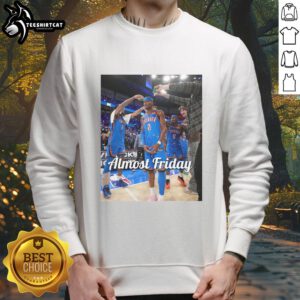 Shai Gilgeous-Alexander in an Oklahoma City Thunder sweatshirt, celebrating after a game, showcasing team pride.