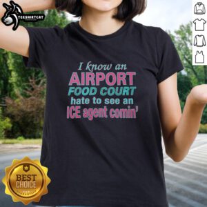 Premium 'I Know An Airport Food Court' Ladies Tee featuring a humorous ice agent graphic, perfect for travel lovers.