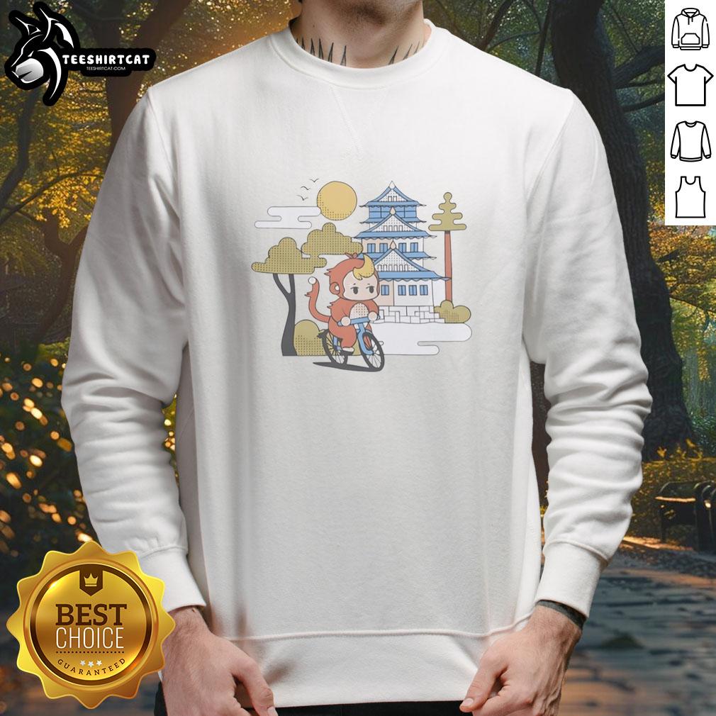 Cute monkey riding a bicycle wearing a 'Cdawgva Out For A Ride' sweatshirt, showcasing a fun and playful scene.