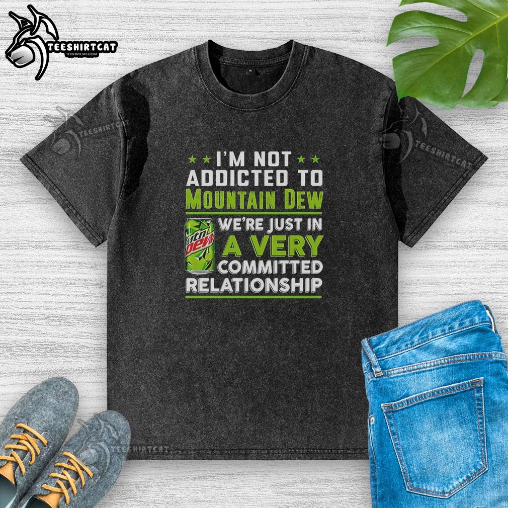 Funny 'I'm Not Addicted to Mountain Dew' washed t-shirt featuring a vibrant green design and relaxed fit.