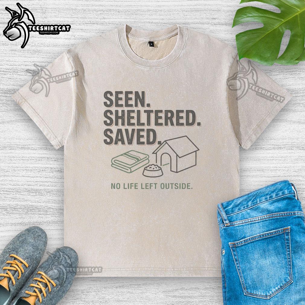 Washed T-shirt with 'Nice Seen Sheltered Saved No Life Left Outside' design, perfect for casual wear and eco-conscious fashion.
