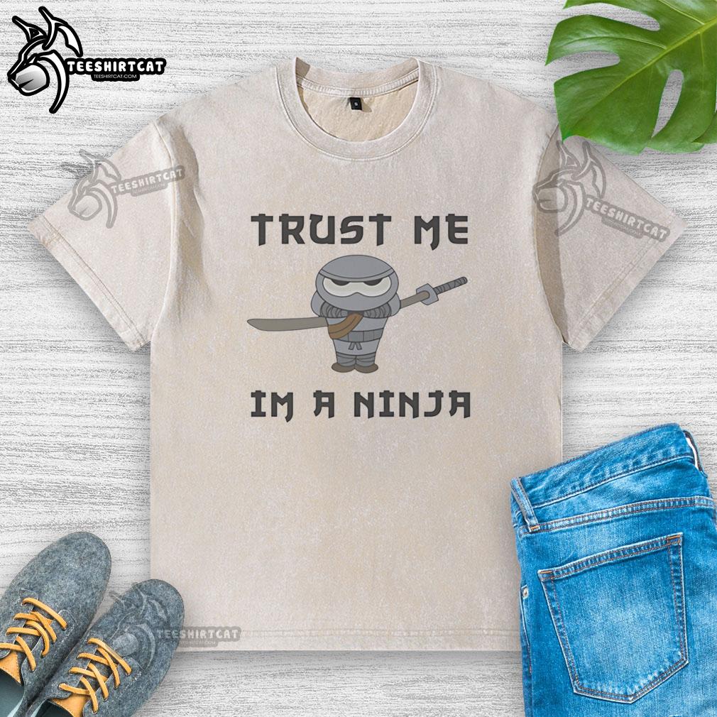 Alt Text: Premium cute ninja holding katana on a washed t-shirt, featuring the phrase Trust Me, I'm a Ninja.