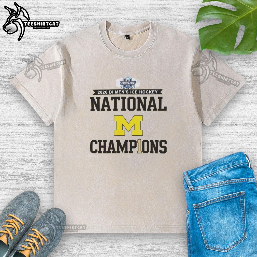 Premium Michigan Wolverines 2026 Di Men's Ice Hockey Frozen Four Champions washed t-shirt in navy blue.