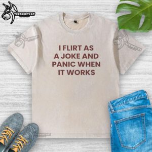 Funny quote on a washed t-shirt: 'I flirt as a joke and panic when it works' - perfect for casual wear.