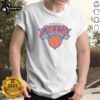 Official New York Knicks Bacon Egg N Cheese Shirt displayed on a hanger against a vibrant background.