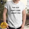 Original The Ucp Don'T Care About You Black Text Shirt displayed on a wooden background