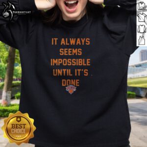 Top It Always Seems Impossible Until It Is Done New York Knicks Basketball Sweatshirt in navy blue with bold white and orange lettering